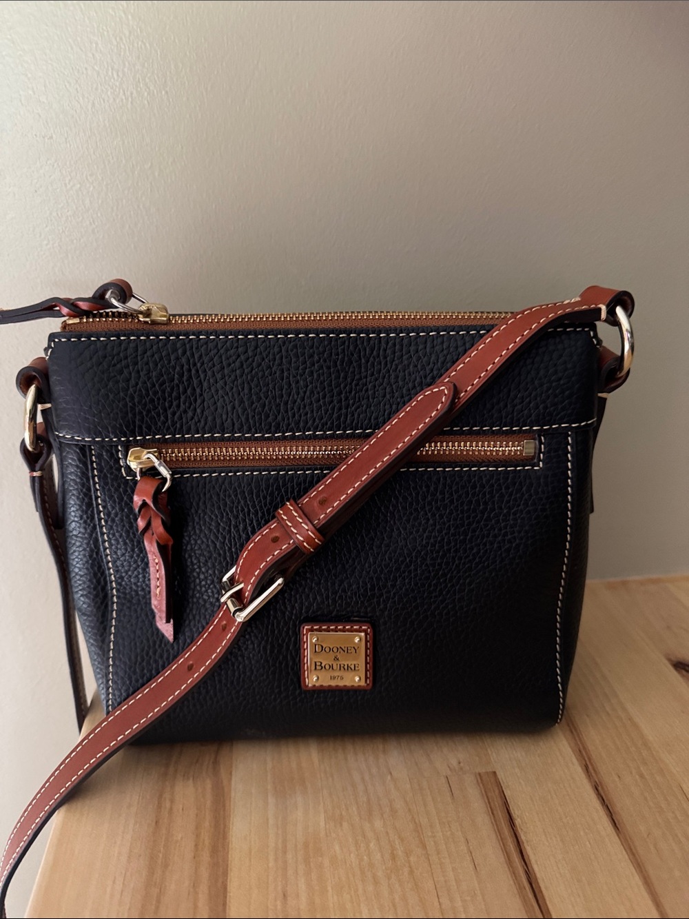 Dooney & Bourke Black Pebble Leather Crossbody with Brown Trim and Gold Hardware
